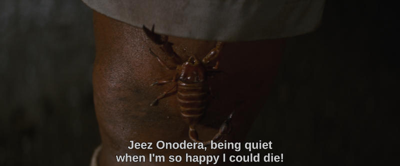 Color image. A scorpion crawls up an unsuspecting man's leg. The subtitle reads, Jeez Onodera, being quiet when I'm so happy I could die!