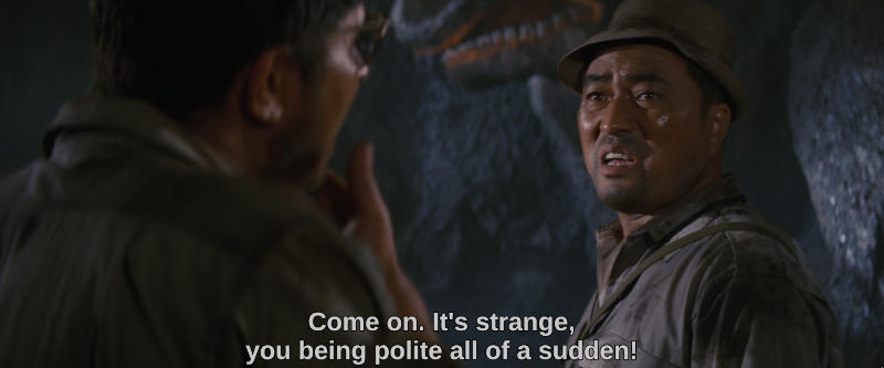 One explorer looks to another, saying Come on. It's strange, you being polite all of a sudden!