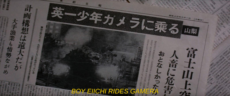 A close-up of a newspaper front page showing the monster Gamera landing in a fairground. The subtitle reads, Boy Eiichi Rides Gamera.
