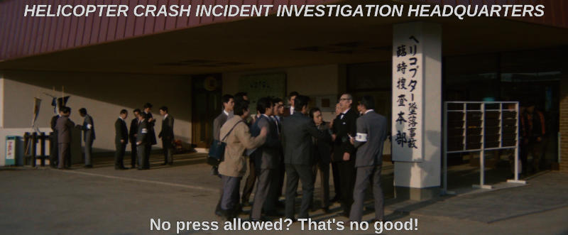A rowdy rabble of reporters gather outside of the headquarters of a crash investigation. The subtitle reads, No press allowed? That's no good!